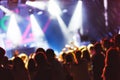 Bright colorful background with the silhouettes dancing young people during the performance favorite musician.