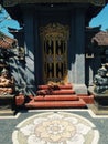 Bright colorful Balinese entrance with hindu sculptures sunny day Indonesia