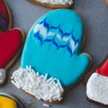 Bright and colorful, beautifully decorated Christmas cookie made to look like a blue mitten