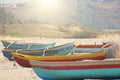 Bright colorful boats for fishing were on the shore of the Indian Ocean. India, Goa Royalty Free Stock Photo