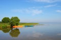 Bright colorful boats on the lake in a calm sunny day