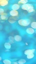 Bright and colorful bokeh lights create an abstract pattern on a blue-green background. Surface of calm blue water Royalty Free Stock Photo