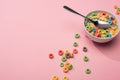 Bright colorful breakfast cereal with milk in bowl with spoon Royalty Free Stock Photo