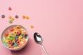 Bright colorful breakfast cereal with milk in bowl with spoon Royalty Free Stock Photo