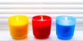 Bright colorful candles. Scented colorful candles with lighted wicks