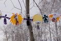 Bright colorful carnival or party frame of balloons, streamers and confetti on a rustic yellow wood table with central copy space Royalty Free Stock Photo