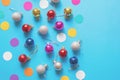 Bright colorful Christmas balls on blue background. Flat lay, copy space Royalty Free Stock Photo