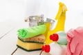 Bright colorful cleaning set on a wooden table