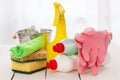 Bright colorful cleaning set on a wooden table