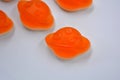 Bright and colorful, colored jelly children\'s sweets, candies in the form of orange planets, an asteroid, jupiter