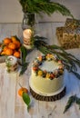 Bright colorful Cristmas cake with green and pink dots decorated with berries isolated on white. Kids party homemade