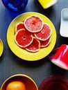 Bright Colorful dishes red cup blue vase yellow plate yellow cup on pink background still life background illu