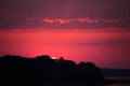 Bright, colorful evening landscape over the river Daugava of pink and purple tones. Dramatic sunset scenery Royalty Free Stock Photo