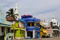 Bright colorful fishermen houses near colonial church