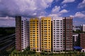 Bright colorful HDB flats buildings in Singapore, against cloudy blue sky. Panoramic view Royalty Free Stock Photo