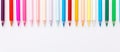 A bright and colorful image of a row of colored pencils on a white background. The pencils are arranged in a rainbow Royalty Free Stock Photo