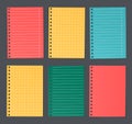 Bright colorful lined and squared notebook paper are stuck on dark background Royalty Free Stock Photo