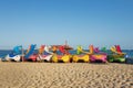 Bright colorful pedal boats with water slides at the beach in Magaluf