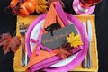 Bright and colorful pink, orange and black modern Happy Halloween table place setting