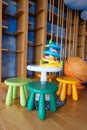 Bright colorful plastic furniture for children standing on the playground. Royalty Free Stock Photo