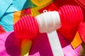 Bright colorful plastic hammers and bunting for festival or party