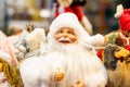 Bright colorful Santa Claus doll in red costume with long white beard. Christmas and New Year holidays traditional decorations