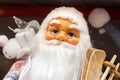 Bright colorful Santa Claus doll in red costume with long white beard. Christmas and New Year holidays traditional decorations