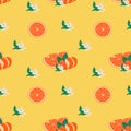 Bright colorful seamless pattern with orange fruit, skin peel, leaves and blooming flowers. Juicy tropical summer fruits Royalty Free Stock Photo