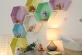 Bright colorful shelves on wall in room. Interior design