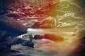 Bright Colorful Sunlight Rays over a River Stream in the Deep Mountain Forest Royalty Free Stock Photo