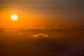 Sun setting over a sea of clouds Royalty Free Stock Photo