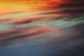 A bright and colorful sunset in the sky covered with clouds