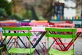 Bright colorful tables of Parisian outdoor cafe on Montmartre Royalty Free Stock Photo