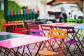 Bright colorful tables of Parisian outdoor cafe on Montmartre Royalty Free Stock Photo