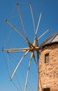 Old Greek windmill against blue sky. Patmos Island, Greece