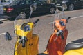 Bright colorful Vespa scooters parked on a street in London