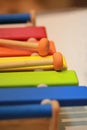 Bright colorful wooden children toy xylophone on a shelf in the shop. Royalty Free Stock Photo