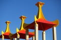Bright wooden rooftops of the children outdoor playground against blue summer sky Royalty Free Stock Photo