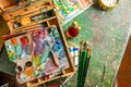 Bright Colorful workplace of the artist with brushes and oil paints