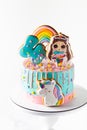 Bright colorfull cake for a little girl on the white background