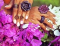 bright colorfull shot of african tanned hands with manicure amon Royalty Free Stock Photo