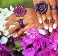 bright colorfull shot of african tanned hands with manicure amon