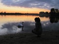 Girl, swan, sunset in Mogilev.
