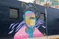 Bright colors of street art graffiti on exterior walls of buildings Austin, Texas, 2018 M