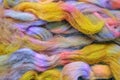 Bright coloured spinning wool roving. Background.