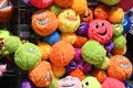 Bright, colourful, colorful, smiling smiley plushy toys on a seaside souvenir stall shop. Southend on Sea Royalty Free Stock Photo