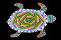 A gel pen drawing of a colorful patterned turtle.