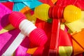 Bright colorful plastic hammers and bunting for festival or party