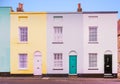 Bright colourful symmetrical row, terrace houses each with two s Royalty Free Stock Photo