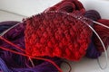 Bright colourful yarn ball with knitted crochet and needles. Bright gradient threads with beautiful knitting pattern.